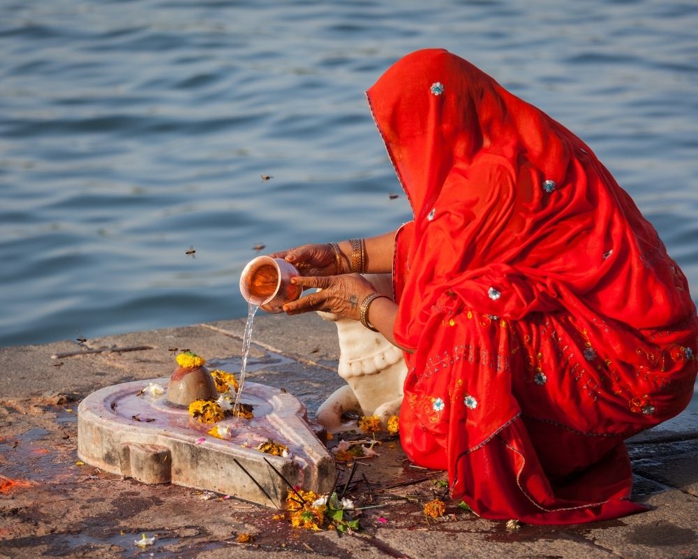 woman carrying bouquets of roses